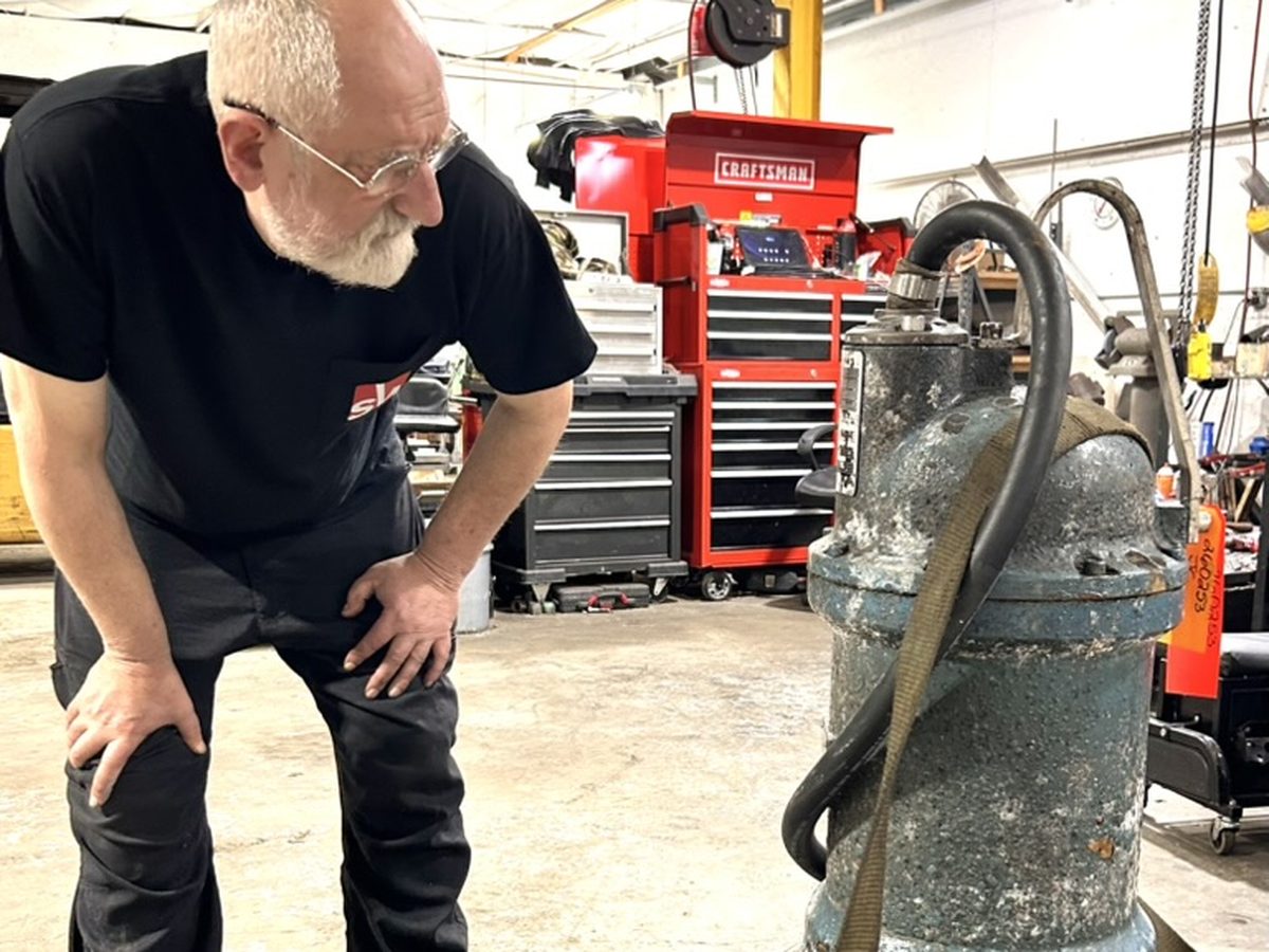 EASA-certified repair shop technician inspecting a pump